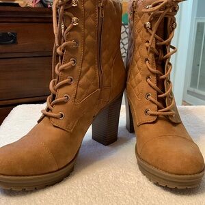 G-By Guess tan high top heel boots. Lace up and side zipper.